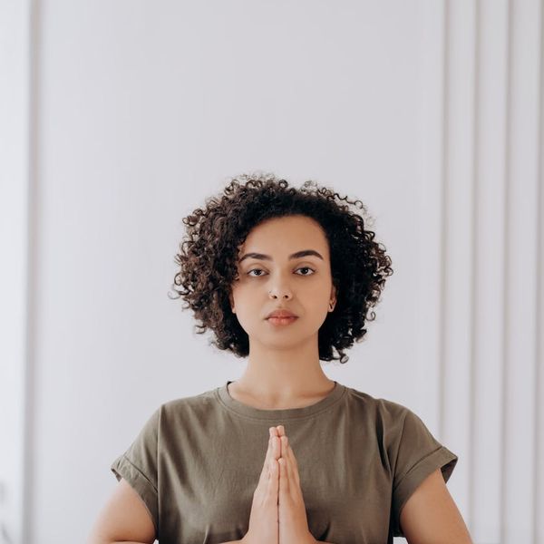 Person meditating in a serene environment, symbolizing inner peace and relaxation.